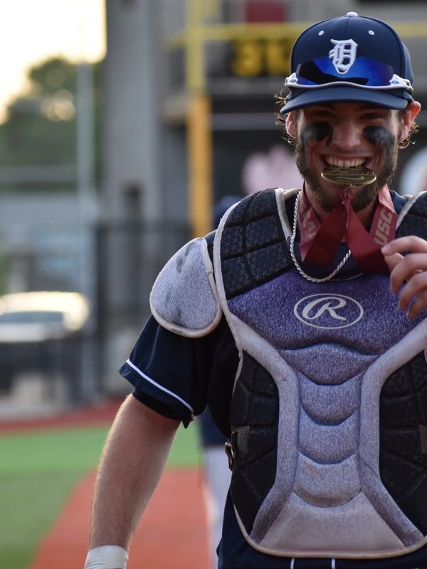 Baseball catcher with medal