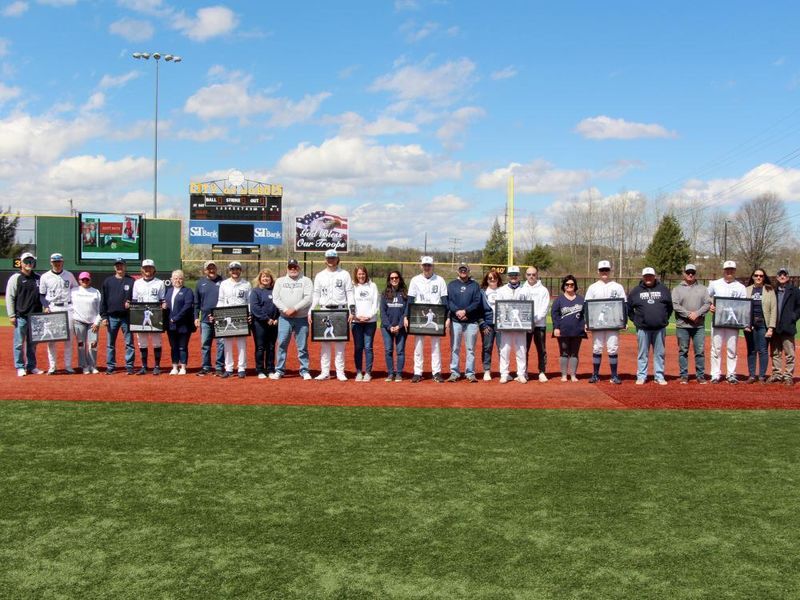 The senior members of the baseball team at Penn State DuBois, along with their family members, during their senior day recognition at Showers Field in DuBois.